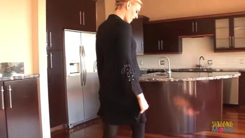 Tattooed blonde with a great rear enjoys interracial kitchen action and gulps cum