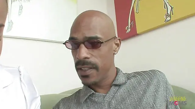 Dark-haired beauty receives a massage following intense sexual play with a Black man