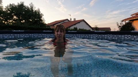 'Bikini bottoms fly as he ravishes me in the pool's turbulent waters'